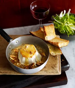 Honey-baked goat’s cheese with walnut, pear and frisée