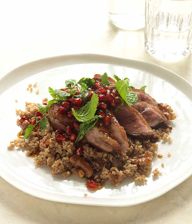 Cracked wheat and walnut pilaf with duck and pomegranates