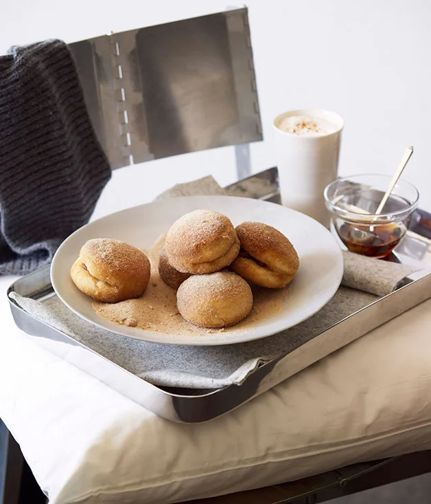 Apple-filled doughnuts with maple syrup