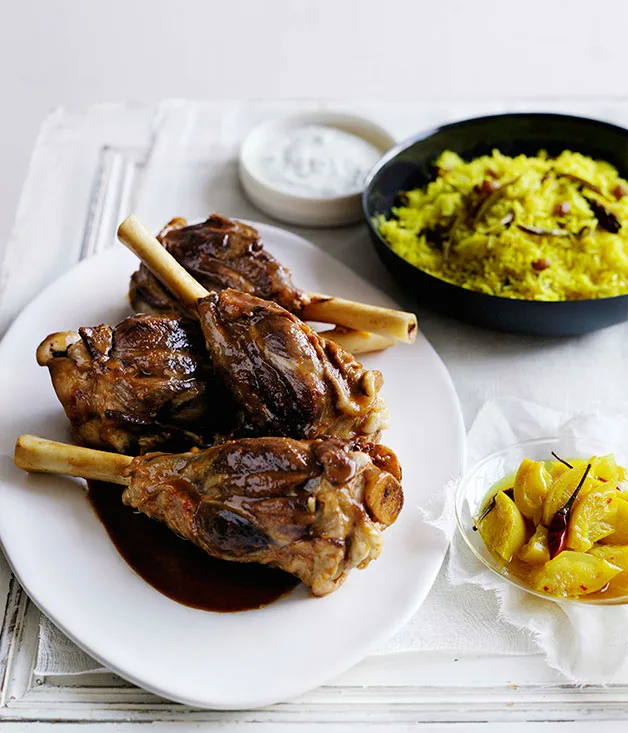 Fragrant lamb shanks with kishmish pilau and lemon and turmeric pickles