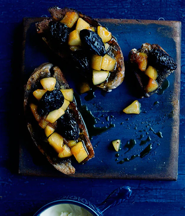 Baked pear and walnut tartines with frontignac, prunes and clotted cream