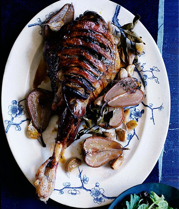 Slow-roasted leg of lamb with rosé pears and cloves of garlic