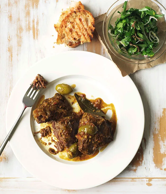 Spanish braised beef cheeks with tomato bread, parsley and anchovy salad