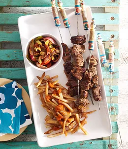 Moroccan beef kebabs with harissa chips and grilled vegetable salad