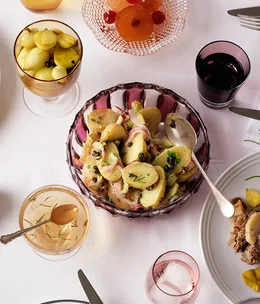 Warm potato salad with celery, red onion and capers