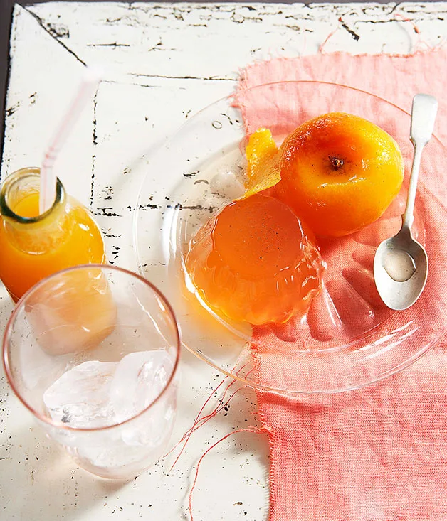 Peaches poached in prosecco with peach jelly