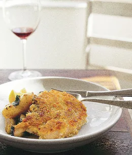 Crumbed pork cutlet with sautéed apples, potatoes and sage