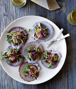 Scallops with citrus dressing and sprouts