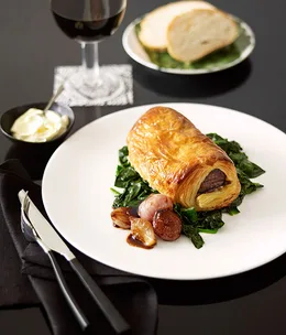Wellington of venison with caramelised shallots and sour cream dressing