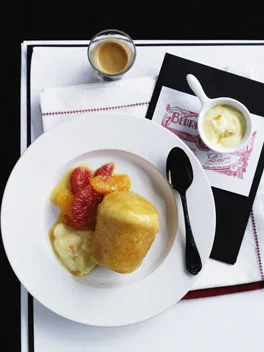 Baba au rhum with bitter orange cream and citrus salad