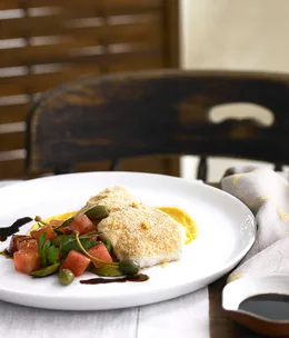 Olive oil-poached groper with romesco crumbs, pumpkin purée and caperberry and olive salad