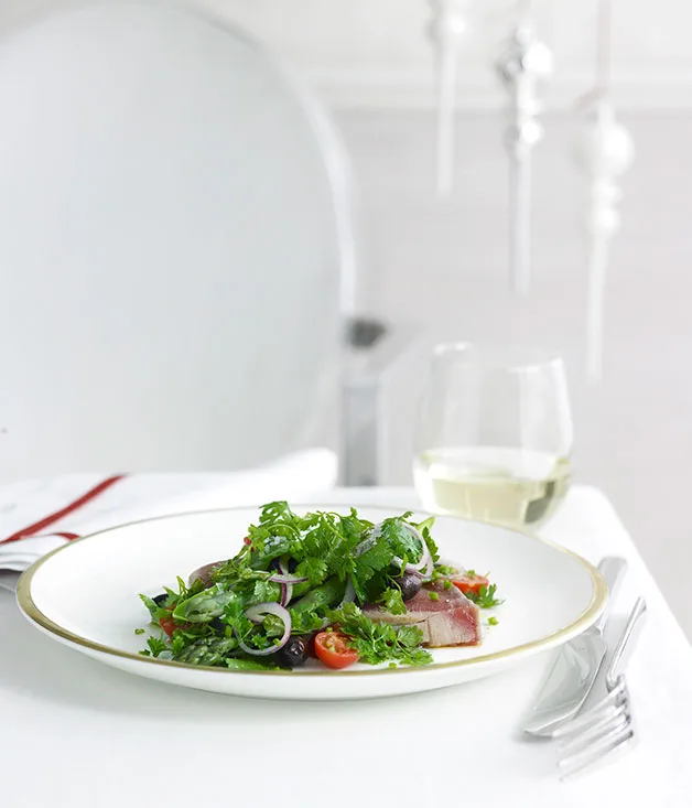 Seared yellowfin tuna with black olive and petite herb salad