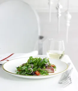 Seared yellowfin tuna with black olive and petite herb salad