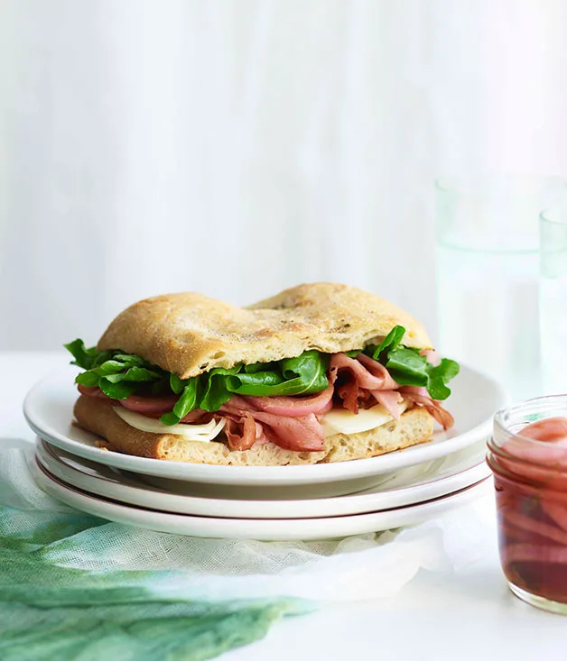 Mortadella sandwich with pickled onions and provolone