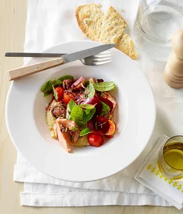Confit ocean trout with quick hummus and tomato and sumac salad