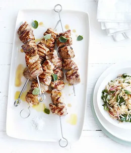 Grilled pork neck and oregano skewers with orzo salad