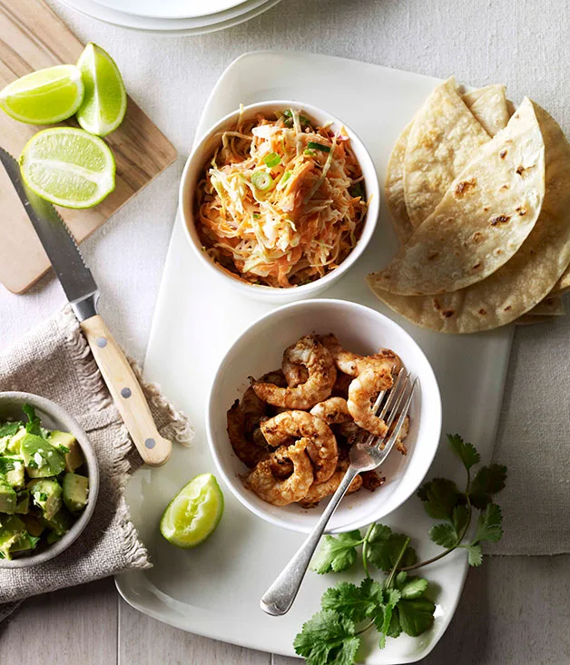 Soft prawn tacos with coleslaw, avocado and coriander