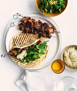 Grilled cumin and chilli lamb skewers with smoky eggplant purée