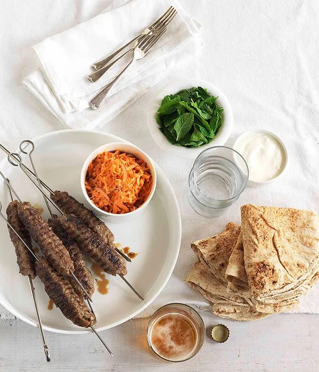 Barbecued lamb kofta with shredded carrot, mint and yoghurt