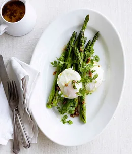 Asparagus with egg and garlic and anchovy butter