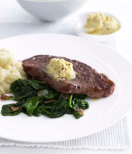 New York steak with garlic-wilted spinach