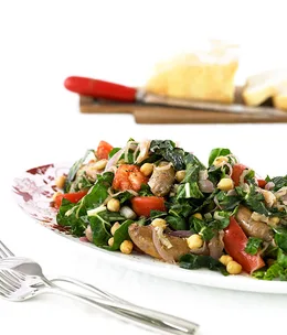 Spicy chipolatas with silverbeet and chickpeas