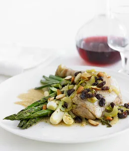 Pan-roasted chicken with sultanas, almonds and celery