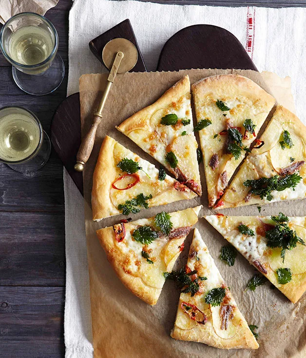 Potato, mozzarella and anchovy pizza with fried nettles