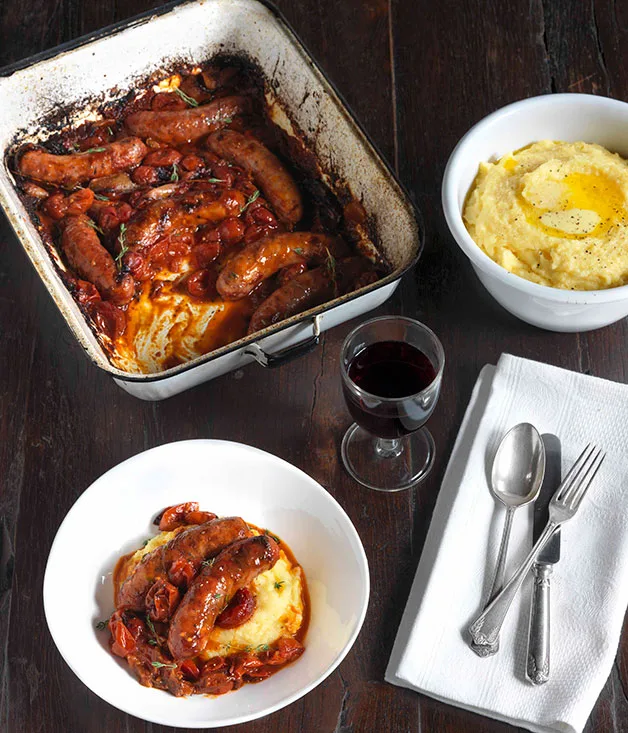 Sausages with roasted onion, tomato and polenta