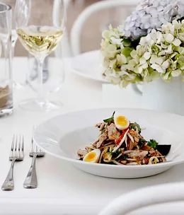 Poached chicken and coconut salad with smoked quail’s eggs and Asian herbs