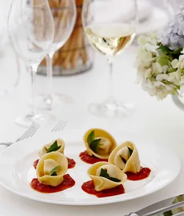 Ricotta parmesan tortellini with tomato sugo and basil