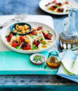 Squid with roast tomato dressing, Sicilian olives and garlic crumbs