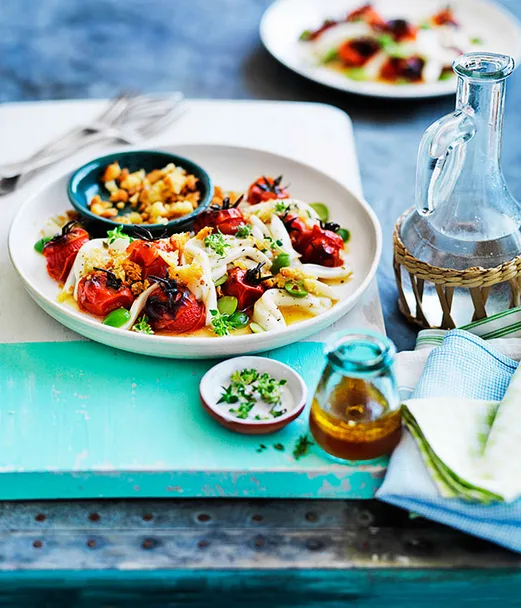 Squid with roast tomato dressing, Sicilian olives and garlic crumbs