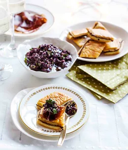 Anchovy and onion pastries with tapenade and bresaola