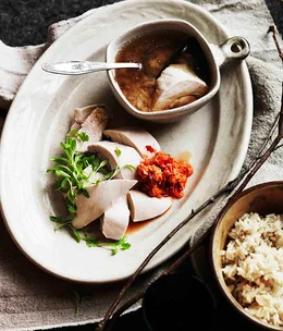 Poached chicken, rice and ginger-scented broth