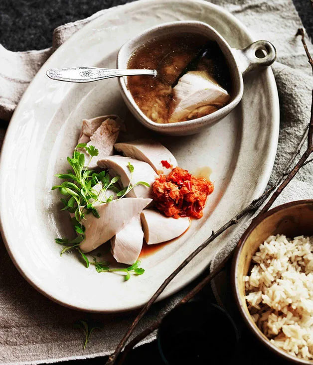 Poached chicken, rice and ginger-scented broth