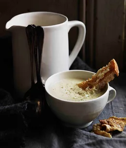 Creamed chicken and leek soup with crisp chicken skin