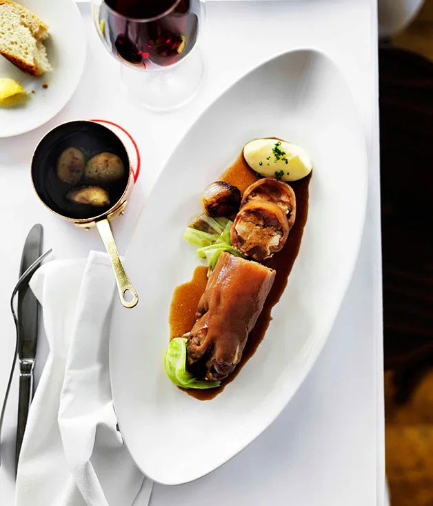 Braised stuffed pig's trotters with cabbage, shallots and potato purée