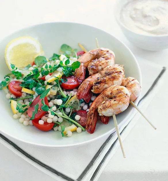Warm moghrabieh salad with barbecued prawn brochettes and almond tarator | Gourmet Traveller