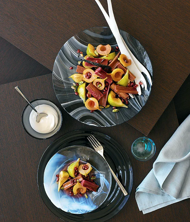 Autumn salad of pomegranate, pear and fig in rhubarb syrup