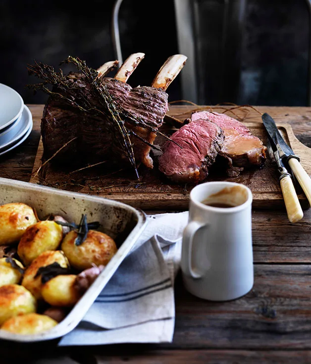 Rib roast of beef with pan gravy and roast potatoes