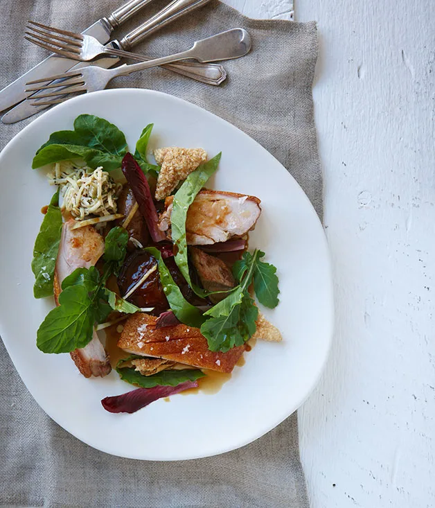 Roast suckling pig with bitter greens and apple