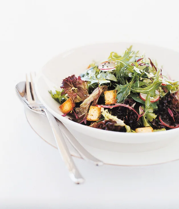 Salad farm lettuces with radishes, baby croutons and citrus vinaigrette