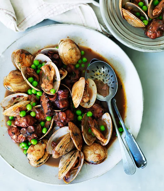 Octopus braised in red wine with clams and peas