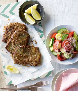 Beef cotoletta with tomato and oregano salad