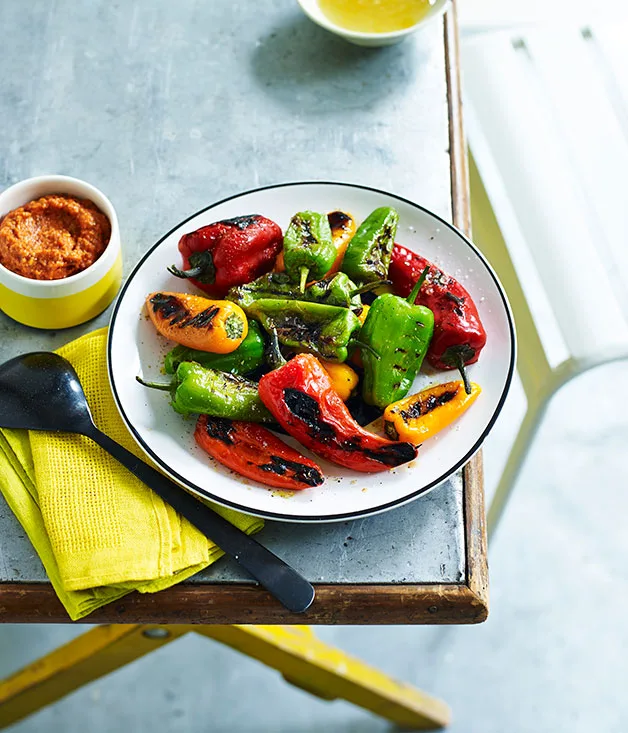 Charcoal-roasted peppers with lemon jam and romesco