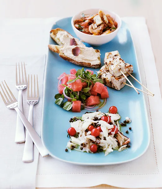 Swordfish kebabs with watermelon salad (pictured with school prawn saganaki, taramasalata toast and crab salad with cherry tomatoes and capers)