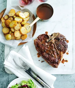 Grilled pepper steak with fried garlic potatoes