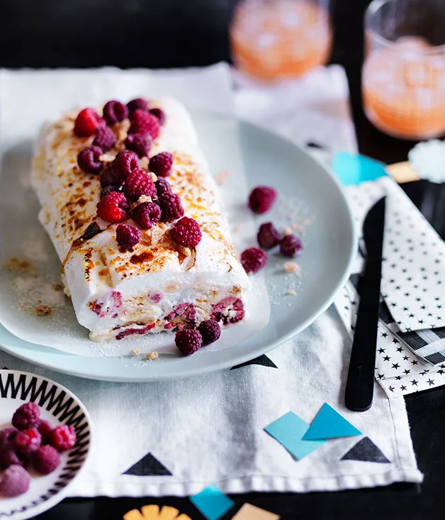 Sesame praline meringue roulade with rosewater raspberries