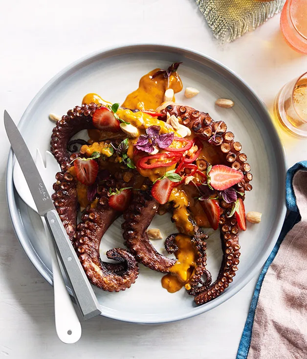 Coal-grilled octopus with smoked butter and almonds, chilli and green strawberries